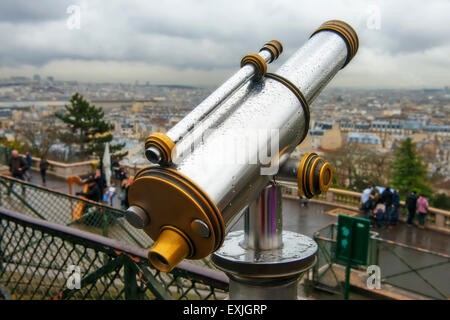 Telescope looking out over Paris from the Scare Coeur Stock Photo