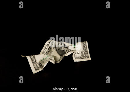 Crumpled American dollar bill on a black background Stock Photo