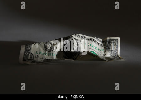 Crumpled American dollar bill on a black background Stock Photo