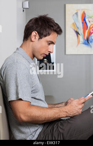 Man waiting his turn in the waiting area Stock Photo