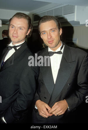 GARY KEMP (at left ) and brother Martin in 1990 at premiere of film The Krays Stock Photo