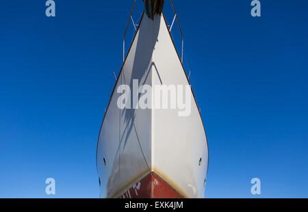 Close up of front side of big ship in port. Ship trunk on blue sky background Stock Photo