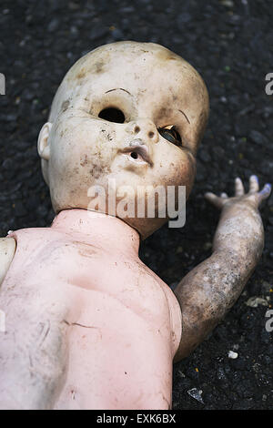 Scary Baby Doll On Street Stock Photo