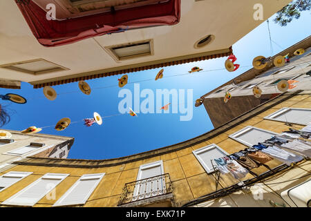City Streets Decorated with Straw Hats, wide angle Stock Photo