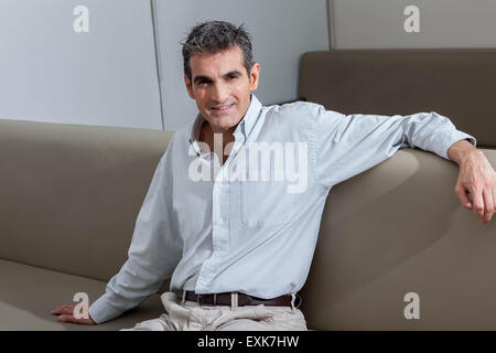 Man siting in the  waiting area. Stock Photo