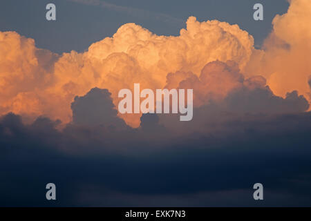 Big clouds in the evening light Stock Photo