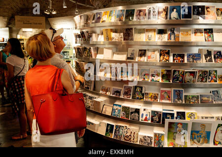 Tourists buying postcards in the Picasso Museum ( Museu Picasso ) gift shop, Barcelona, Spain, Europe Stock Photo