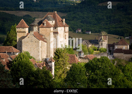 Evening sunlight over Château des Plas and medieval town of Curemonte, in the ancient Department of Limousin, Correze, France Stock Photo