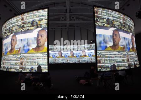Frankfurt, Germany. 14th July, 2015. Visitors look at art works at the exhibition of the American artist Doug Aitken, which is held from July 9 to Sept. 27, at the Schirn KUnsthalle Frankfurt, Germany, July 14, 2015. © Luo Huanhuan/Xinhua/Alamy Live News Stock Photo