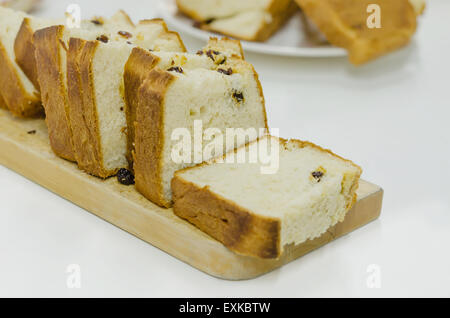 A slice of bread on a chopping board Stock Photo