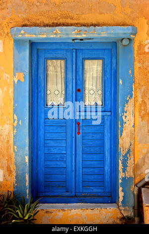 Colorful door at Ano Syra ('Ano Syros'), the old medieval settlement of Syros island, Cyclades, Aegean sea, Greece. Stock Photo