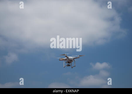 Quadcopter flying in the clouded sky, Tokyo, Japan Stock Photo