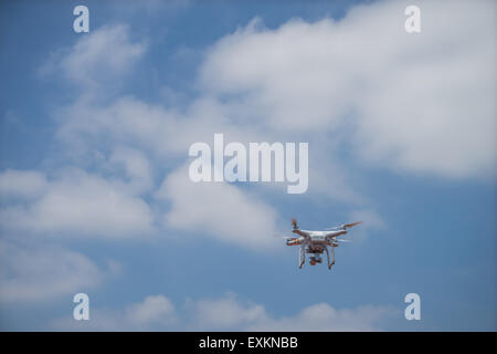 Quadcopter flying in the clouded sky, Tokyo, Japan Stock Photo