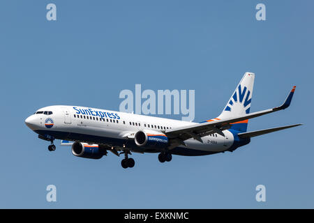 Boeing 737-800 aircraft of the SunExpress airline landing at the international airport in Frankfurt. July 10, 2015 in Frankfurt Stock Photo