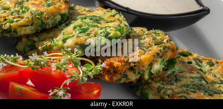 spinach balls with Parmesan served with  garlic sauce and cherry tomatoes Stock Photo