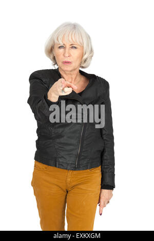 Beautiful woman doing different expressions in different sets of clothes: gun sign Stock Photo