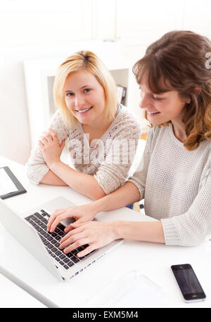 View of Two students girls working on a laptop Stock Photo