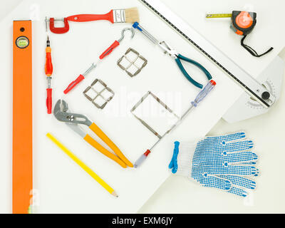 shape of house made with household and construction tools, on white background. perspective view Stock Photo