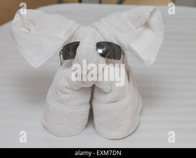 Towel elephant with sunglasses on Stock Photo