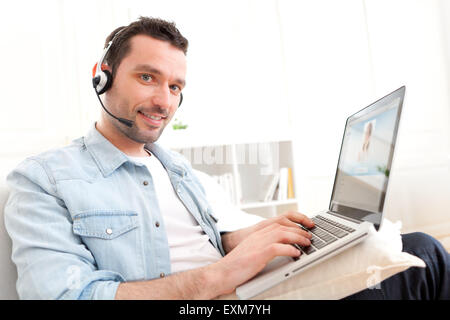 View of a Young relaxed man video-calling on Internet Stock Photo