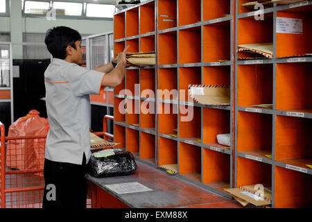 Postal worker at a post office in Boise Idaho USA Stock Photo - Alamy