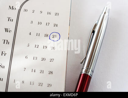 Important Date On Calendar and Pen Stock Photo