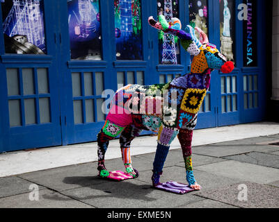 Decorated wire-framed deer, 'Yarn Bombed' & covered with crocheted wool squares of various colours of wool. Blackpool, UK Stock Photo