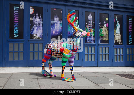 Decorated wire-framed deer, 'Yarn Bombed' & covered with crocheted wool squares of various colours of wool. Blackpool, UK Stock Photo