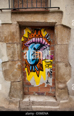 Mouth and tongue urban graffiti on a blind door in Barcelona, Spain. Stock Photo