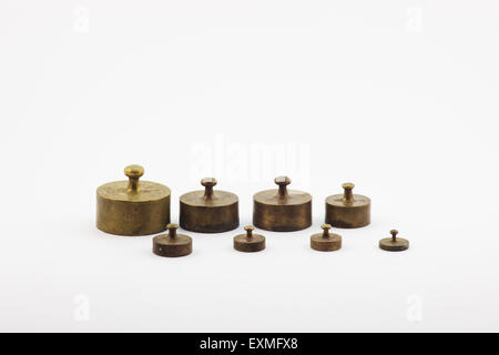 Small brass masses for beam scale Stock Photo