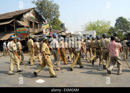 Police personnel patrolling rioters break glass panes vehicles Bhandup Dalit community resort to violent protests Mumbai Stock Photo