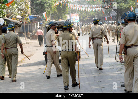 Police personnel patrolling when rioters break glass panes vehicles Bhandup Dalit community resort violent protests Mumbai Stock Photo