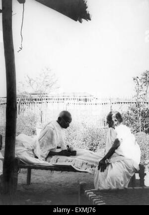 Kasturba Gandhi and Mahatma Gandhi at Sevagram Ashram ; 1938 NO MR Stock Photo
