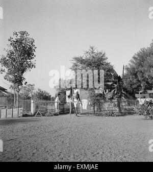Mahatma Gandhi in front of his hut at Sevagram Ashram ; 1942 NO MR Stock Photo