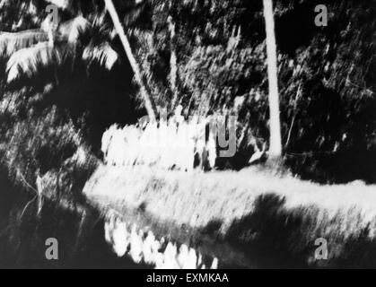 Mahatma Gandhi and his party on march through a forest in the riot stricken area of Noakhali East Bengal Stock Photo