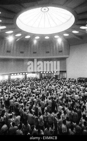 Stock brokers assemble in the ring of the Bombay Stock Exchange (BSE) for trading in Bombay now Mumbai ; Maharashtra ; India Stock Photo