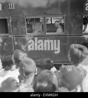 Khan Abdul Gaffar Khan and Mahatma Gandhi sitting in a 3rd class train compartment ; 1947 NO MR Stock Photo