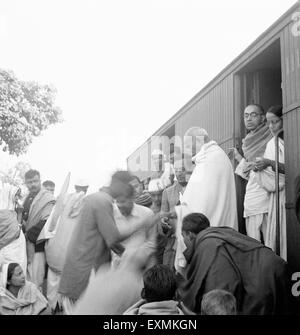 Mahatma Gandhi collecting donations Harijan Fund train station Assam Ramkrishna Bajaj Pyarelal Nayar Prabhatibehn Jayaprakash Stock Photo