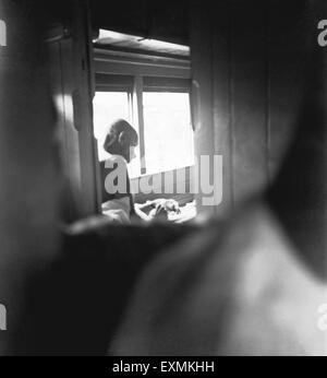 Mahatma Gandhi ; sitting in the train and writing ; 1947 NO MR Stock Photo