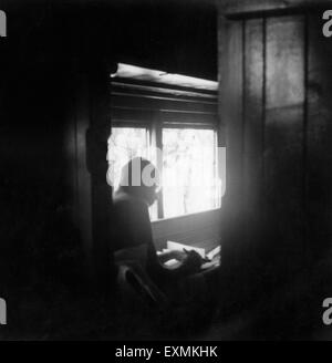 Mahatma Gandhi ; sitting in the train and writing ; 1947 NO MR Stock Photo