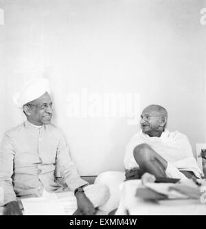 Mahatma Gandhi sharing a laugh with Sarvepalli Radhakrishnan at Birla House Bombay Mumbai Maharashtra India 1944 old vintage 1900s picture Stock Photo