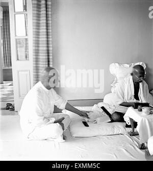 Mahatma Gandhi talking with Sardar Vallabhbhai Patel at Birla House ; Mumbai ; 1945 NO MR Stock Photo