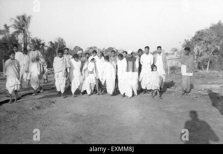 Mahatma Gandhi and his party on the march through the riot effected areas in Noakhali ; East Bengal Stock Photo