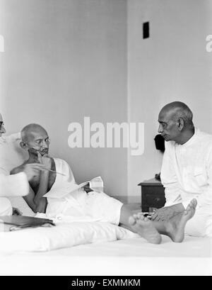 Mahatma Gandhi ; talking with Sardar Vallabhbhai Patel at Birla House ; Mumbai ; August 1942 ; India NO MR Stock Photo