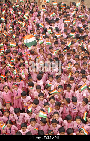 School children celebrating Indian Independence Day by waving Indian flag in Bombay Mumbai Maharashtra India - asb 125024 Stock Photo