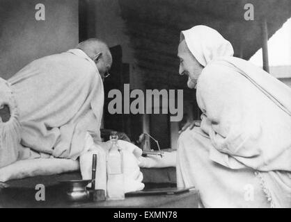 Mahatma Gandhi and Khan Abdul Gaffar Khan talking about spinning at Khadi Pratishthan ; Sodepur ; 24 Parganas ; Calcutta Stock Photo