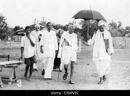 Mahatma Gandhi walking with Rajendra Prasad ; Mahadev Desai and others ...