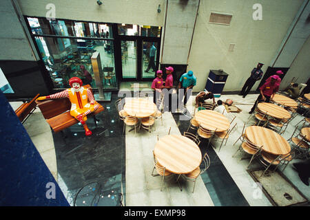 macdonald mascot sitting, empty tables chairs restaurant, Crossroad shopping mall, Crossroads, Sobo Central, Brand Factory, Mahalaxmi, Bombay, Mumbai, Maharashtra, India, Asia Stock Photo