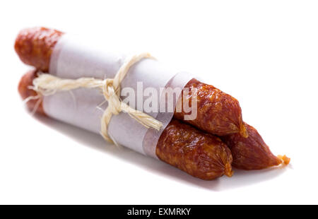 Thin smoked sausages isolated on white background Stock Photo