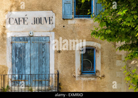Facade of an old house with painted shop sign in Aurel, Provence, France Stock Photo